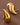 18K Gold Plated Waterproof Stainless Steel Stud Earrings 7080 displayed as a pair against a dark brown background