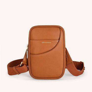 Vegan leather mini crossbody bag in a stylish brown color with a sleek design and adjustable strap.