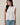 crew neck sleeveless diagonal panel stripe top front view on model