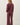 Back view of model wearing burgundy sweater with matching pants
