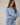 Side view of model wearing blue Round Rolled Hemline Detail Thin Sweater Cardigan