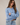 Side view of model wearing blue Round Rolled Hemline Detail Thin Sweater Cardigan