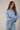 Side view of model wearing blue Round Rolled Hemline Detail Thin Sweater Cardigan