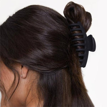 Oversized Matte Claw Clips 2pc Set holding hair securely with a chic matte finish on a woman.