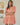 Model wearing the Dixie Split Neck Shift Dress Drift Floral in Org Pinks Multi, showing breathable fabric and split neckline.