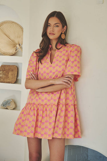 Model wearing the Dixie Split Neck Shift Dress Drift Floral in Org Pinks Multi, showing breathable fabric and split neckline.