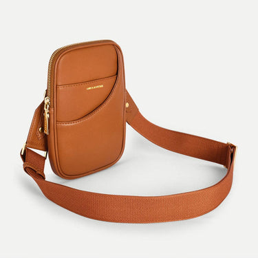 Stylish vegan leather mini crossbody bag in tan color with adjustable strap and elegant design.