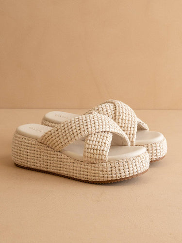 The Fresno Ivory Raffia Platform Sandal featuring a chunky basket weave design and a comfortable slip-on style.