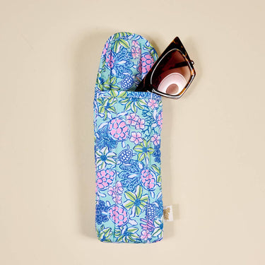 Puffy Sunglasses Case Coastal Cove with floral pattern and sunglasses, perfect for protection and style.