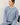 Model wearing light blue Cloud sweatfleece cropped shirt