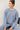 Model wearing light blue Cloud sweatfleece cropped shirt