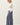 Side view of model wearing white Ultra Soft Essential Basic Crewneck Button Up Cardigan