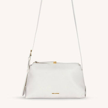 Mira & Moss Audrey Crossbody Bag in white vegan leather with gold-tone hardware and adjustable strap.