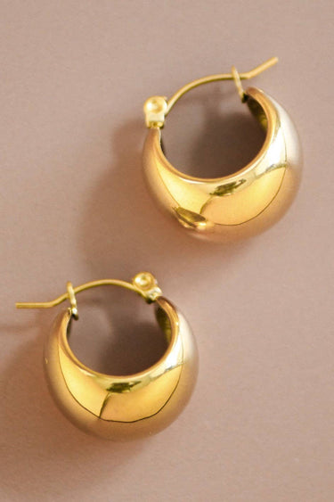 18K Gold Plated Waterproof Stainless Steel Hoop Earrings 7463 showcasing the rounded design from an angled view