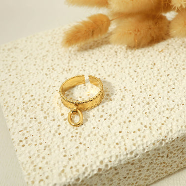 Golden ring with a pendant