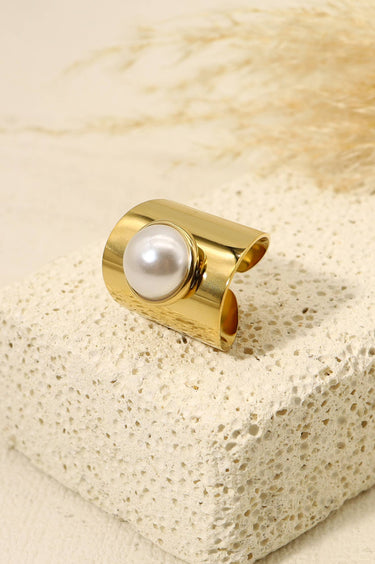 Large gold ring with white natural stone