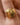 18K Gold Plated Waterproof Stainless Steel Ring 7964 worn on a finger, showing its decorative gold design