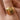 18K Gold Plated Waterproof Stainless Steel Ring 7964 worn on a finger, showing its decorative gold design