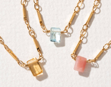 Prism Gems Birthstone Necklace - October featuring pink Peruvian opal and geometric link chains.