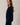 Side view of model wearing navy blue Round Rolled Hemline Detail Thin Sweater Cardigan