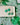 Shamrock Earrings Clover Clay Earrings Clover Earrings displayed on a plate with a green shamrock background.