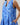 Kaidy Tropical Loly Trapeze Mini Dress featuring a blue ruffle trim split neckline and pockets.
