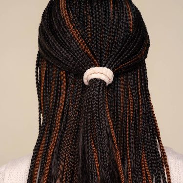 Recycled Fabric Hair Elastics used to secure a stylish braided hairstyle.