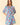 Floral Printed Split V-Neck Half Bell Sleeve Dress displayed on a model, showcasing vibrant floral patterns and ruffle details.