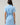 Back view of Saida Striped Kenda Shift Mini Dress in blue and white stripes featuring a drawstring waist and short sleeves.