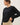 Model wearing black short sleeve top
