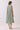 Back view of Striped Smocked Waist Round Neck Midi Dress, showcasing the smocked waist and flowing A-line skirt.
