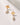 Ethereal Dainty Post Earrings featuring white pearls and gold half-moon posts, stylish and classic accessory.