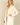 Shop Wall open front long sleeve cardigan in cream with side pockets worn by a blonde model