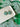 Two Tone Shamrock Earrings Clover Clay Earrings displayed on a plate with a green shamrock background.