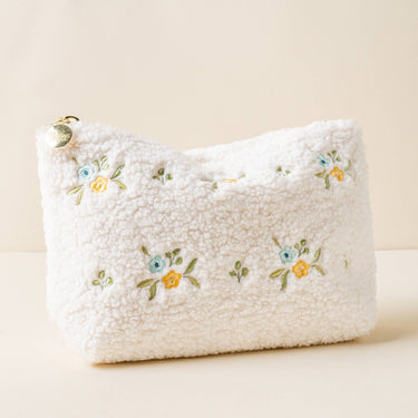 Teddy Pouch-Dainty Floral Blue + Yellow, soft sherpa pouch with floral embroidery and gold zipper.
