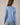 Back view of model wearing blue Round Rolled Hemline Detail Thin Sweater Cardigan