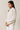 Side view of model wearing beige melange Half Zip Funnel Neck Long Sleeve Pullover Top