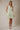 V Neck Button Up Sleeveless Print Dress front view on model in green zebra print