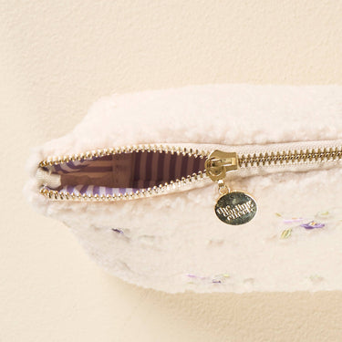 Teddy Pouch-Dainty Floral Purple showing gold zipper and soft sherpa fabric with floral detailing.
