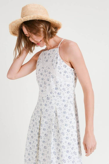 Model wearing Floral Print Pleated Fit & Flare With Embroidery dress and a straw hat.