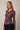 Front view of model wearing burgundy Mock Neck Long Sleeve Button Up Top