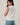crew neck sleeveless diagonal panel stripe top side view on model
