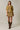 Full length view of model wearing mustard yellow short sleeve sweater cardigan
