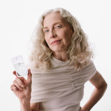 Woman using Unscented Power Mist Hydrating Hand Sanitizer