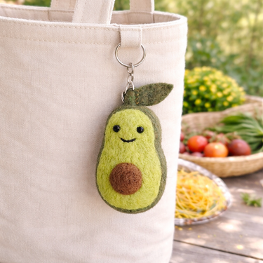 Felt Keychain - Smiley Veggies featuring a cute avocado design hanging from a bag.