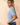 Side view of model wearing blue Round Neck Puff Short Sleeve Cable Sweater with blue jeans