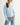 Pearl Button Ribbed Knit Cardigan in light blue shown on a model