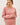 Model wearing pink cotton modal fleece sweatshirt, front view