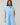 Model wearing Saida Striped Kenda Shift Mini Dress in blue and white stripes, front view
