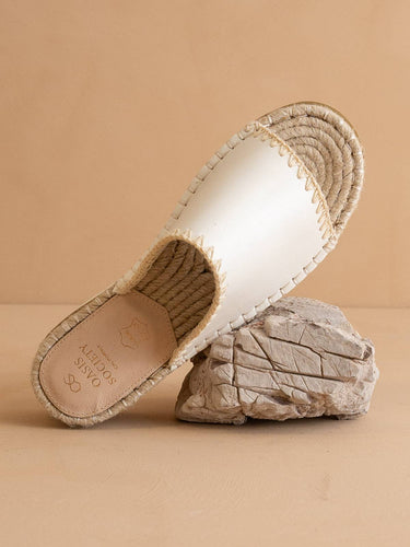 The Vista White Espadrille Platform Summer Sandal on a stone background, featuring vegan leather and espadrille details.